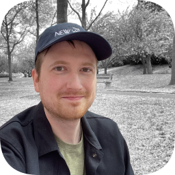 Picture of Tim Bueno sitting at the Brooklyn Botanic Garden